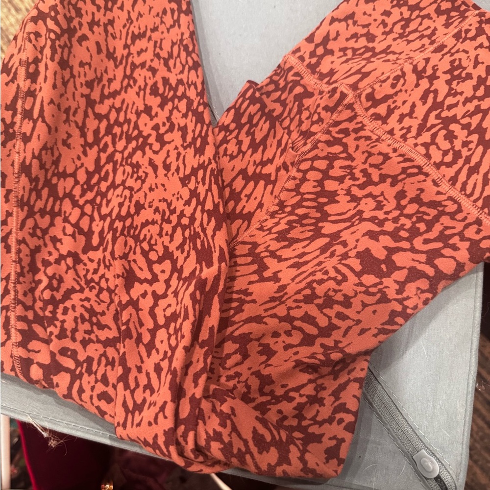 Athleta cheetah print leggings. Barely. Worn  not my style. VGUC